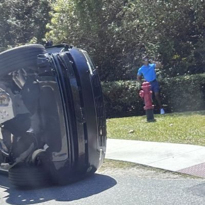 Tiger Woods charged with driving under the influence after hitting another vehicle and rolling his car